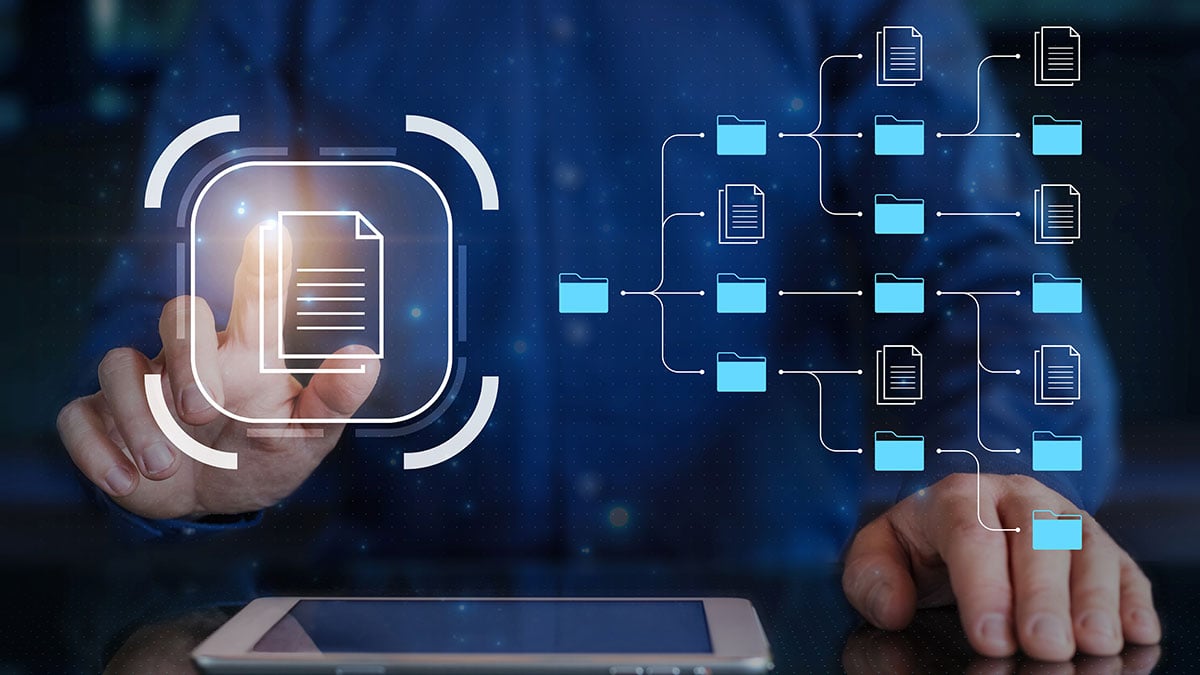 Document-management-system-(DMS)-and-business-process-automation-technology-being-setup-by-IT-consultant-working-on-digital-tablet-computer