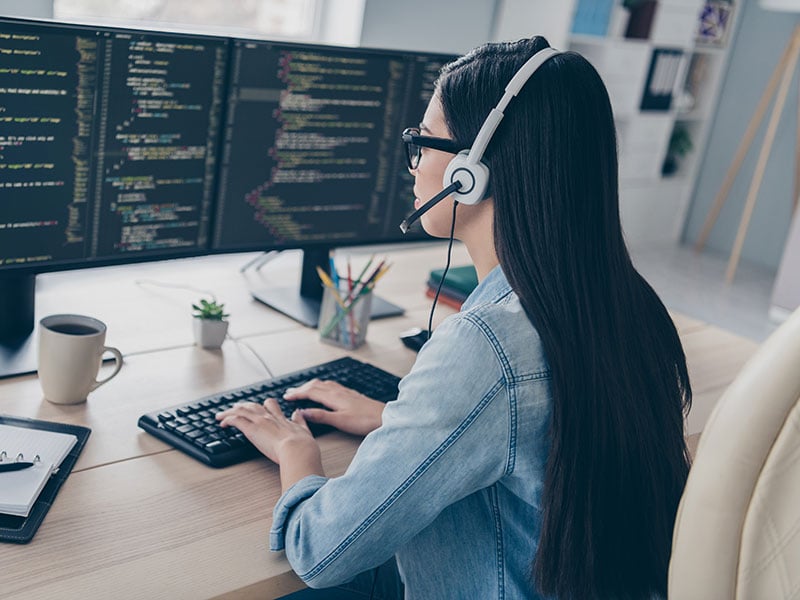 Profile-side-view-portrait-of-attractive-smart-clever-long-haired-girl-editing-script-database-source-at-workplace-workstation-indoors